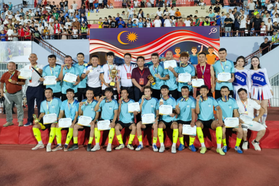 Chia Wee Keat playing football with team