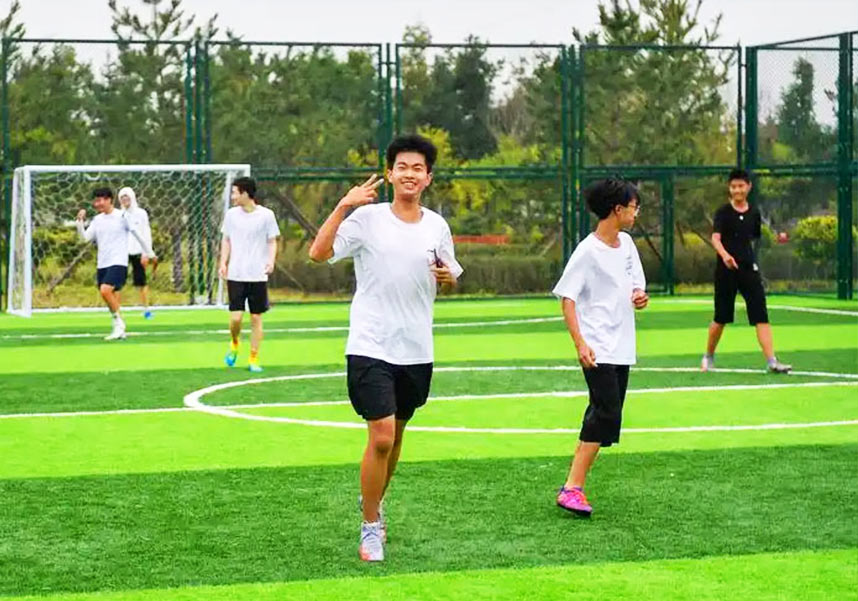 Chia Wee Keat playing football with younger friends